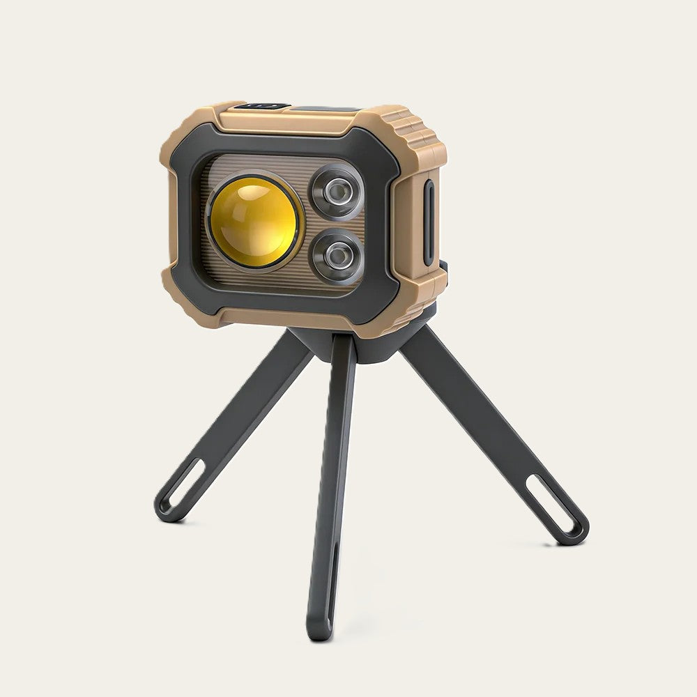 Lampe frontale posée sur son trépied, utilisée comme lampe d'appoint